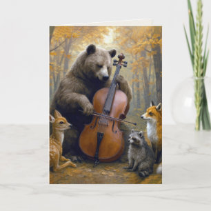 Geburtstagsbär, der im Herbstwald Cello spielt Karte