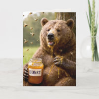 Geburtstagsbär isst Honig aus einem Glas