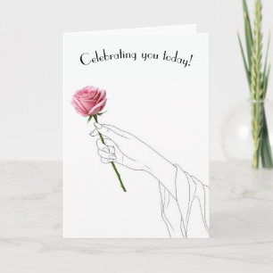 Geburtstagshand hält eine rosa Rose Karte