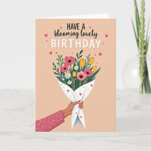 Geburtstagskarte mit Blumen in der Hand Karte