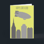 Geburtstagskarte von Custom Grey and Yellow Blimp Karte<br><div class="desc">Diese schlichte, moderne Geburtstagskarte zeigt eine graue Blimp oder ein Luftschiff über eine Skyline der Stadt vor einem gelben Hintergrund. Der gesamte Text auf dieser Karte kann mithilfe der leeren Vorlagenfelder einfach personalisiert und angepasst werden. Fügen Sie einfach den Namen Ihres Empfängers hinzu oder ändern Sie den Gruß auf der...</div>