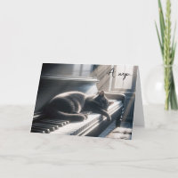 Geburtstagskatze auf Klaviertasten