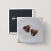 Geformte Pralinen des Herzens auf einer Platte Button (Vorne & Hinten)