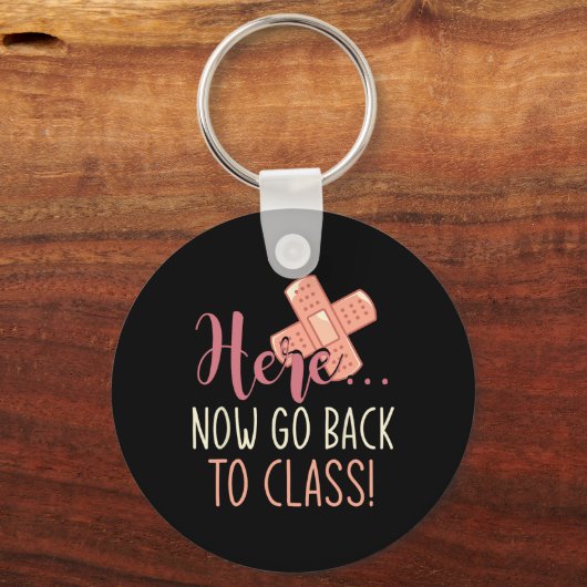 Gehen Sie jetzt zurück zu den Schulkrankenpflegern Schlüsselanhänger (Rückseite)