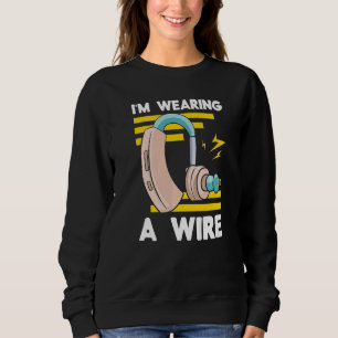 Gehörlosen-Bewusstsein mit einem Draht-Hörgerät-Im Sweatshirt