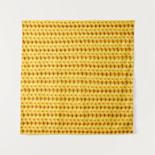 Gelb gestrickter Wollstoffhintergrund Wandteppich