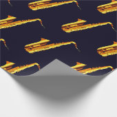 Gelb-orangefarbene Saxophone und schwarzer Hinterg Geschenkpapier (Ecke)