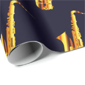 Gelb-orangefarbene Saxophone und schwarzer Hinterg Geschenkpapier (Rolleneckpunkt)