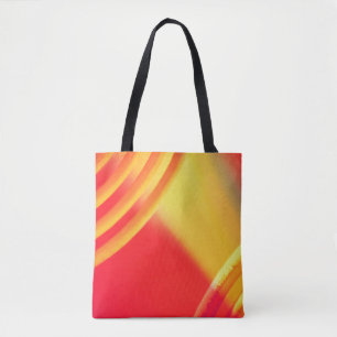 Gelb- und orangefarbenes Rundmuster auf einer Tasc Tasche