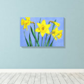 Gelbe Daffodien auf blauem Wrapper der Leinwand (Insitu (Holzboden))