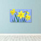 Gelbe Daffodien auf blauem Wrapper der Leinwand (Insitu (Holzboden))