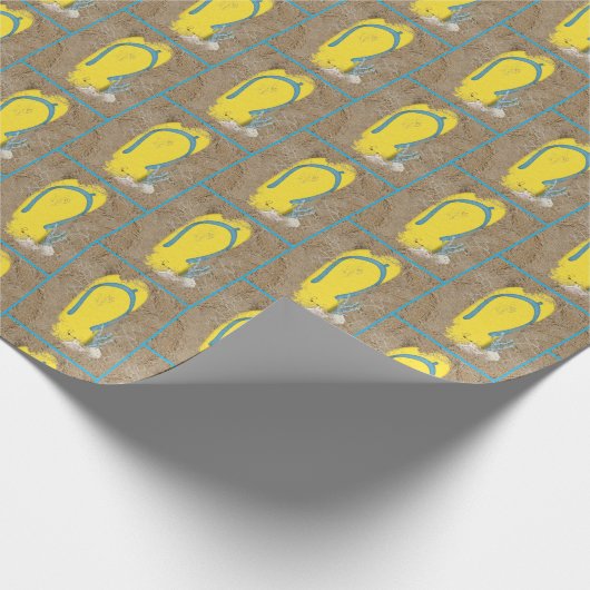 Gelbe Flip Flops im Sand Geschenkpapier (Ecke)