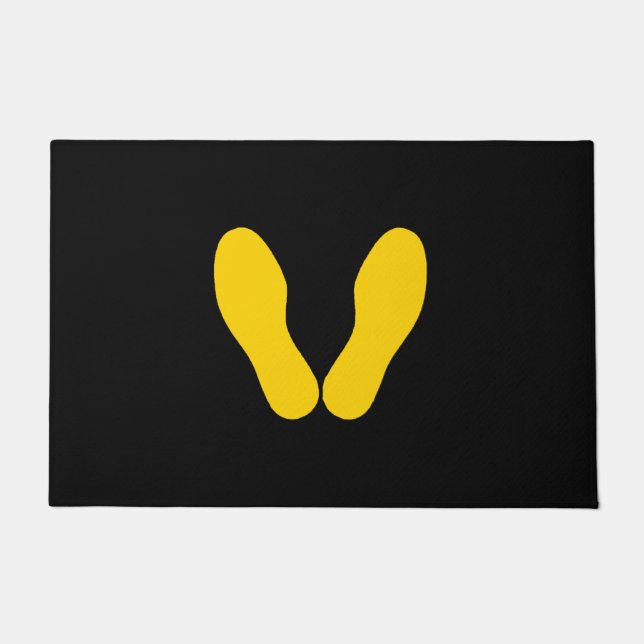 GELBE FUSSDRUCKEN AUF SCHWARZ FUßMATTE (Vorderseite)