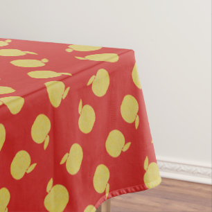 Gelbe gepunktete Äpfel mit rotem Hintergrund Tischdecke