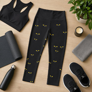 Gelbe Katzenaugen auf Schwarz Capri Leggings