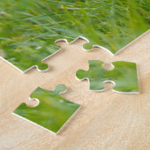 Gelbe Labrador-Plays mit Stick Puzzle (Seite)