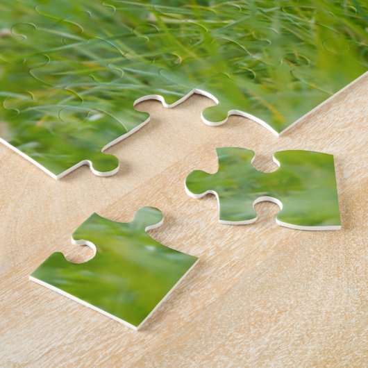 Gelbe Labrador-Plays mit Stick Puzzle (Seite)