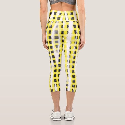 Gelbe schwarze Schachbrettmuster tragen den Namen Capri Leggings (Rückseite)