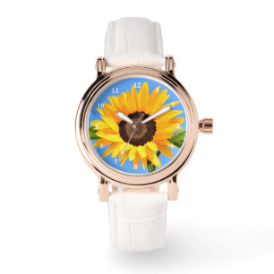 Gelbe Sonnenblume gegen Sonne an blauem Himmel - S Armbanduhr