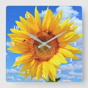 Gelbe Sonnenblumen und Bienen auf blauem Himmel - Quadratische Wanduhr