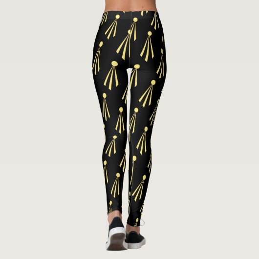 Gelbe Sonnenstrahlen Muster auf schwarz Leggings (Rückseite)