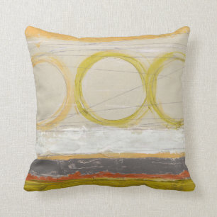 Gelbe u. orange Kreise auf mehrfarbigem Kissen