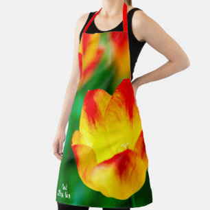 Gelbe und rote Tulip-Blume auf Grün Schürze