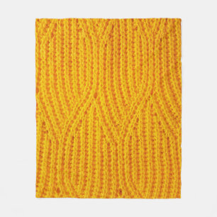 Gelber gestrickter Untergrund aus Spinnstoffen Fleecedecke