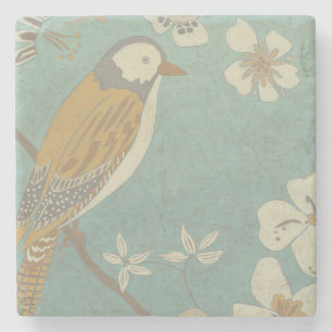 Gelber, grauer und beige Vogel gehockt auf einer Steinuntersetzer