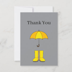 Gelber Regenschirm und Stiefel für regnerische und Dankeskarte