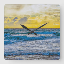 Gelber Sonnenuntergang über blauem Meer Quadratische Wanduhr