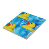 Gelbes Gummiducky in den Blasen Fliese (Seite)