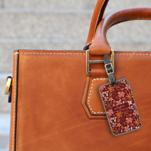 Gelbes orangefarbenes Blumenmuster dunkelrot Gepäc Gepäckanhänger