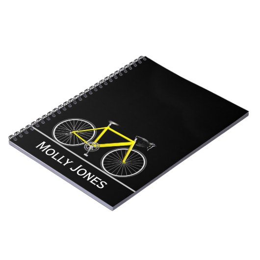 Gelbes Rad mit Namen auf schwarz Notizblock (Linke Seite)
