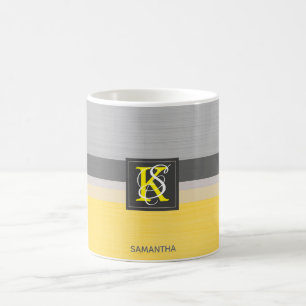 Gelbes und graues Initialen-Monogramm des Kaffeetasse