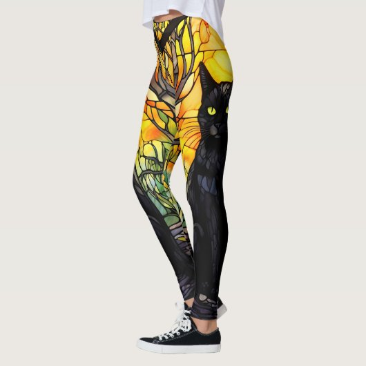 Gelbes Yoga aus schwarzem Kat Leggings (Links)