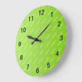 Gemustertes Hintergrunddesign mit heller Kalkgrün. Große Wanduhr (Winkel)