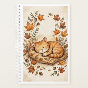 Gemütliche Katze im Herbstplaner Planer