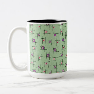 Geometrische Blume und Sticks auf grünem Hintergru Zweifarbige Tasse