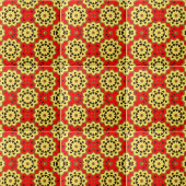 Geometrische Muster der roten und gelben Flora Fliese