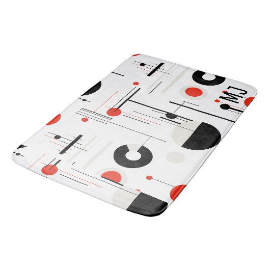 Geometrische, rote, schwarze Bauhaus-Formen auf we Badematte (Schrägansicht)