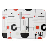 Geometrische, rote, schwarze Bauhaus-Formen auf we Badematte (Vorderseite)