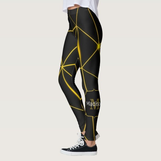 Geometrische schwarze Dreiecke Goldlinien Monogram Leggings (Links)