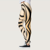 Geometrische schwarze Spirale auf rötlichem Hinter Leggings (Links)