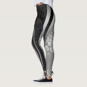 Geometrisches Design der schwarzen und silbernen F Leggings (Links)