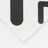 Geometrisches Muster der schwarzen, geometrischen Fleecedecke (Ecke)