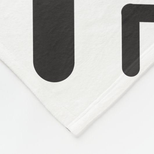 Geometrisches Muster der schwarzen, geometrischen  Fleecedecke (Ecke)