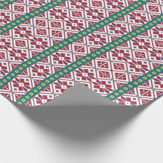 Geometrisches Stammmuster rot, blau und weiß mit S Geschenkpapier (Ecke)