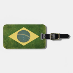 Gepäck-Umbau mit schmutziger Vintager Flagge von Gepäckanhänger