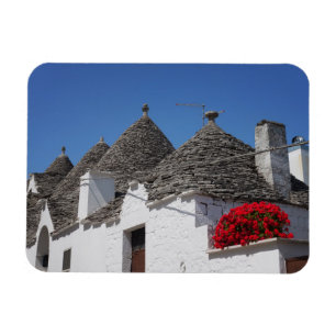 Geranium Blume und Trulli Häuser in Alberobello Magnet